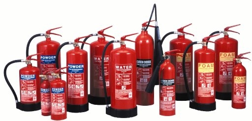 Group of various fire extinguishers including powder, water, CO2, and foam types